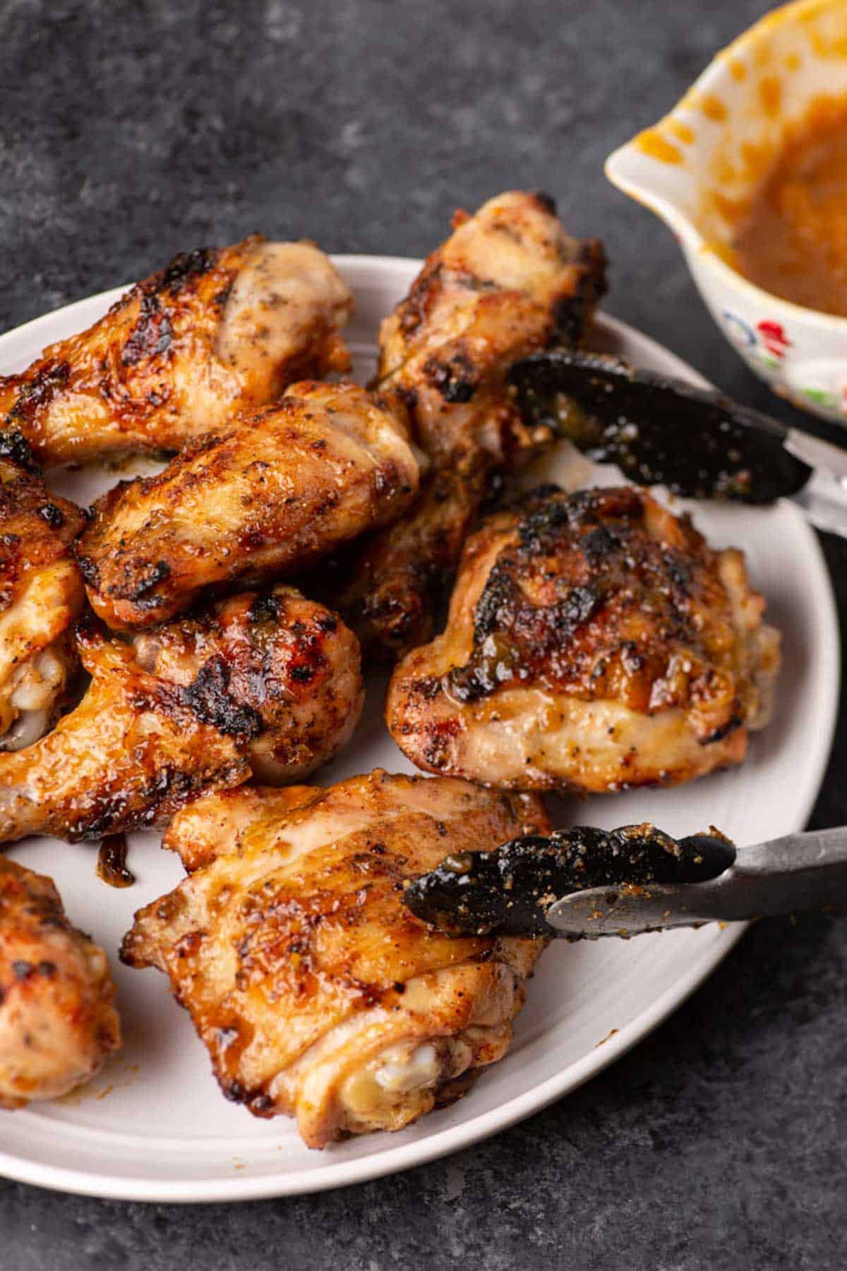 Chicken kabobs on a black platter