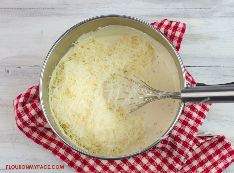 a saucepan filled with the ingredients to make alfredo sauce
