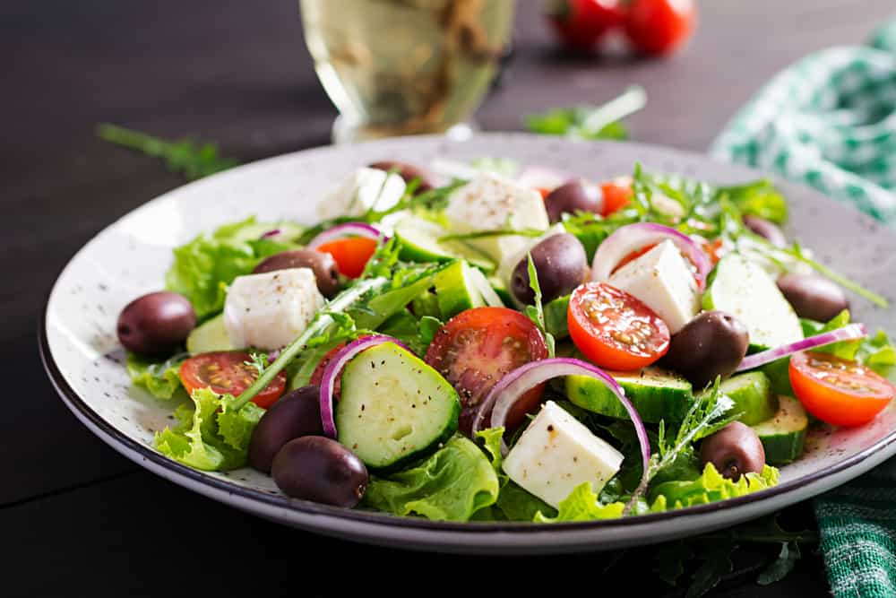 Greek salad with fresh vegetables, feta cheese and kalamata olives