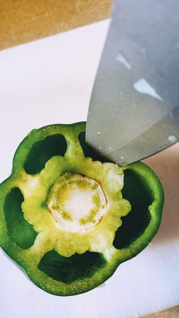 green pepper being seeded