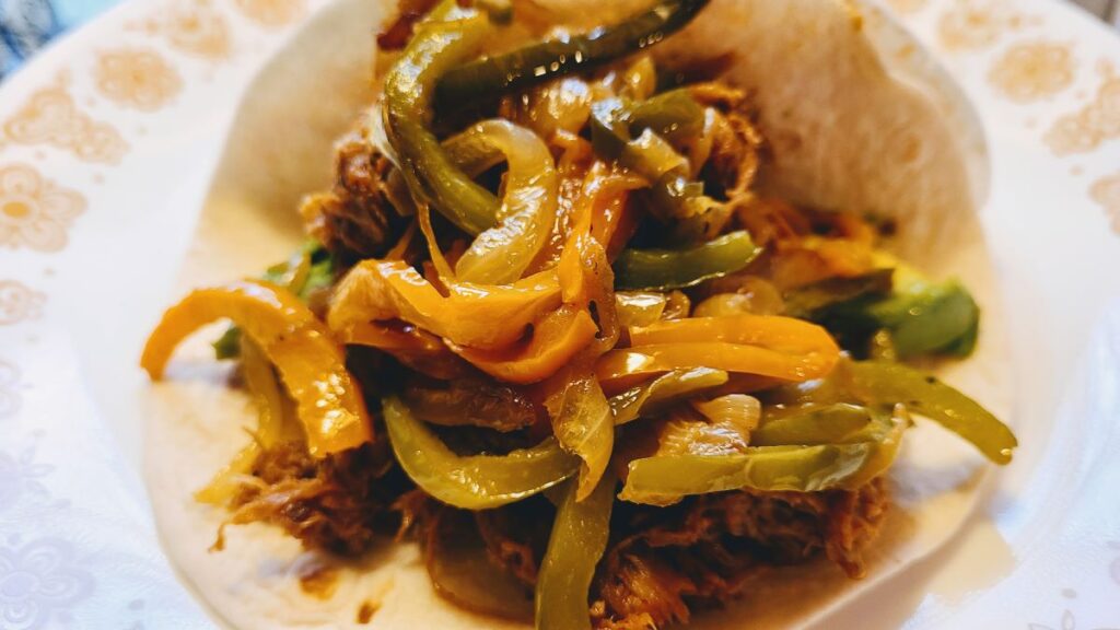prepared pulled pork fajita with peppers and onions from How To Cut Onions And Peppers Into Strips For Fajitas 