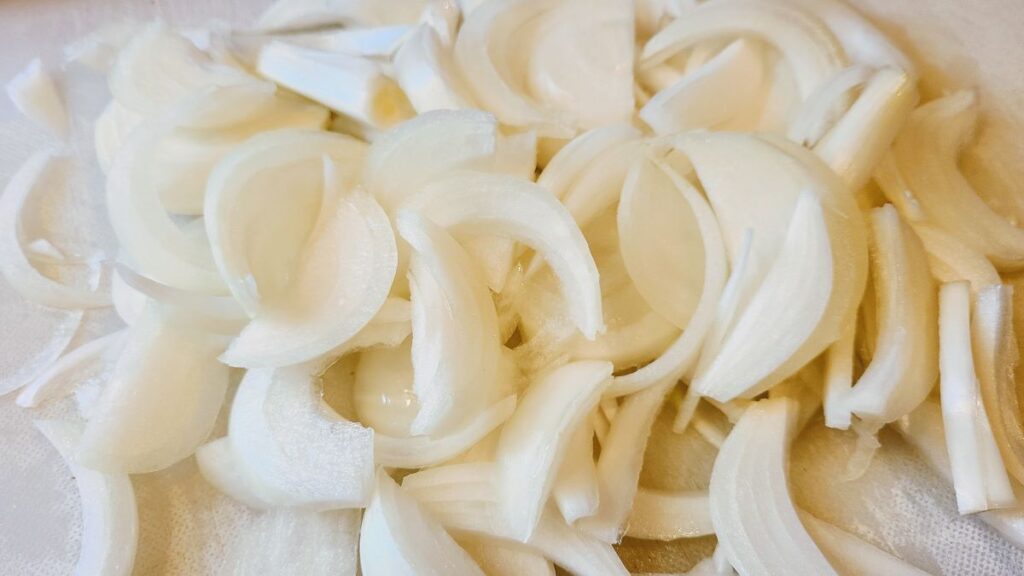 a bunch of slices of yellow onion