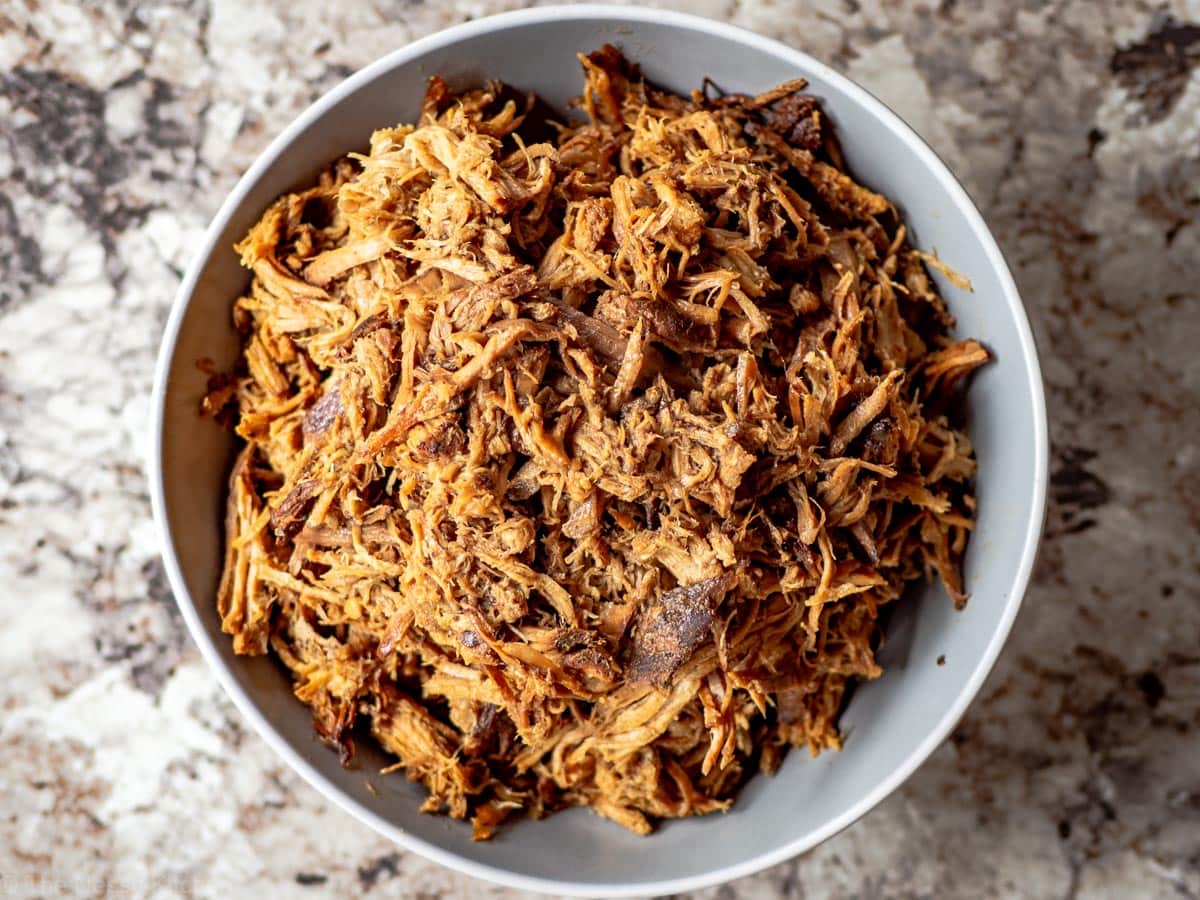 Grey bowl filled with Asian-inspired pulled pork.