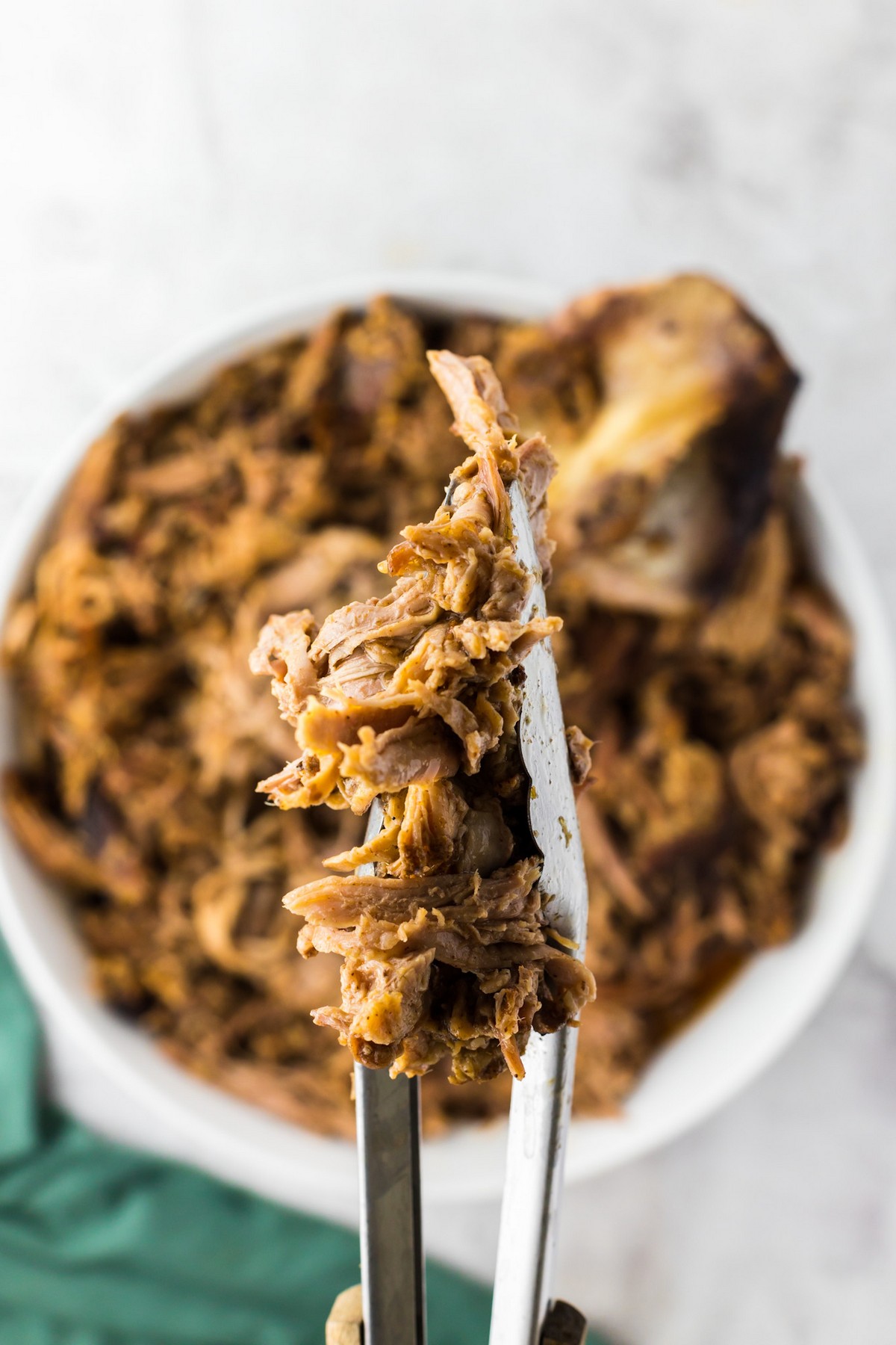 applying rub to pork shoulder